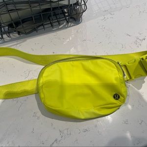 Bright yellow Lululemon belt bag